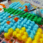 Spiral Eye size 13 Tapestry needle with yarn and grid project