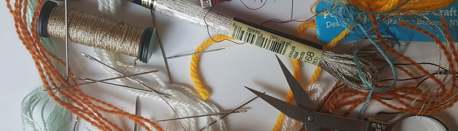Sewing needles and thread and scissors