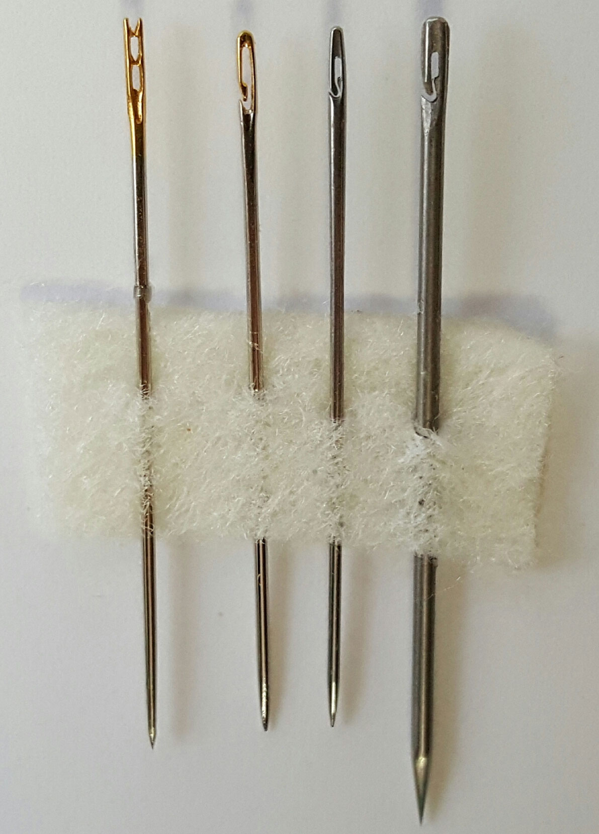 Side by side comparison of easy threading needles